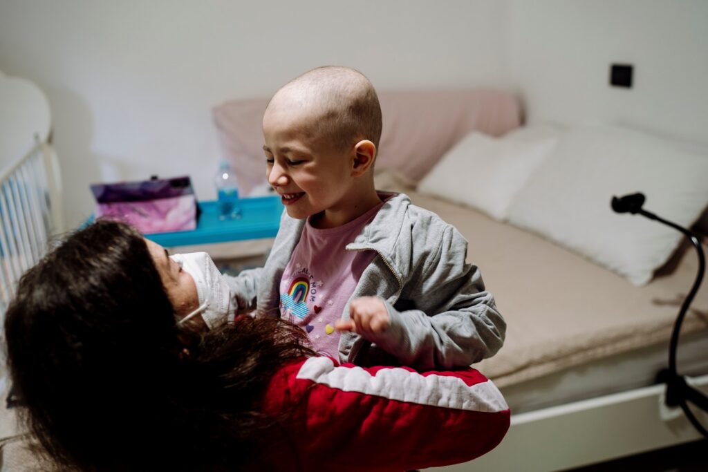 Woman carrying smiling child